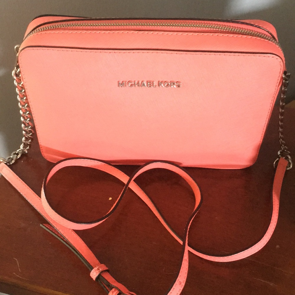 Michael kors cross body purse coral in color